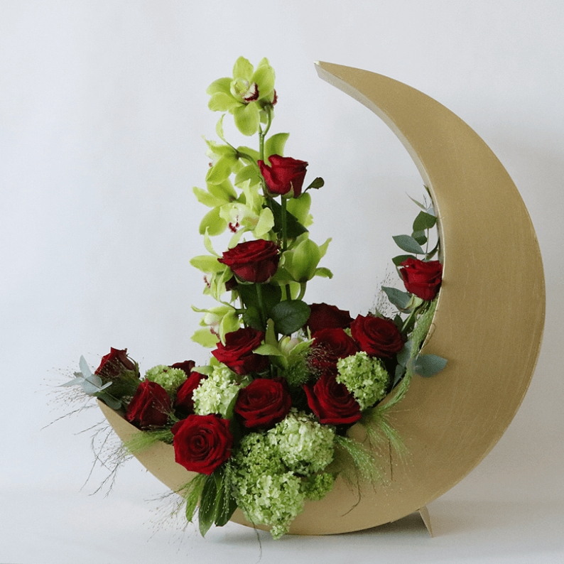 red rose and cymbidium in a gold crescent moon