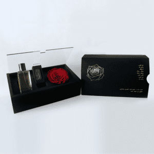 revealing red perfume in a black box with Oud and a long lasting rose amor rose