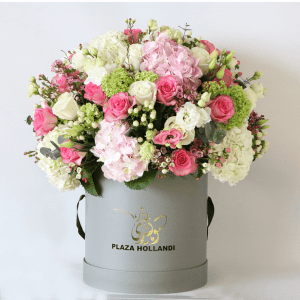 pink rose, white rose, pink hydrangea snowball arranged in a round design in a plaza hollandi hat box