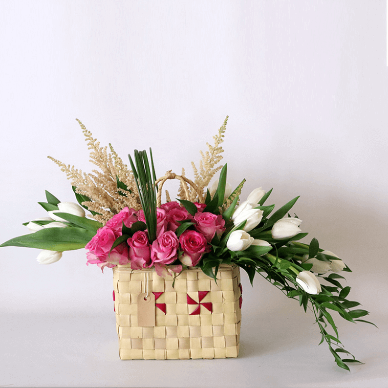 pink roses, white tulips and astilbe in a basket