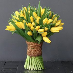 yellow tulips wrapped in rope