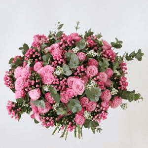 pink mixed spray roses with bouvadia in a bouquet