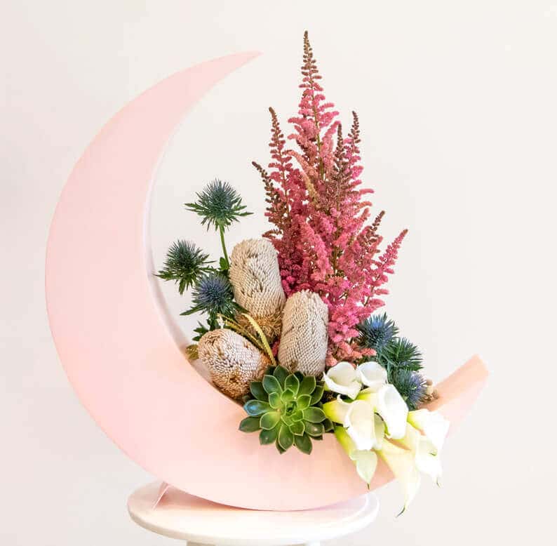 Crescent moon design with dried flowers