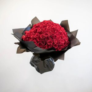 150 red roses wrapped in black paper