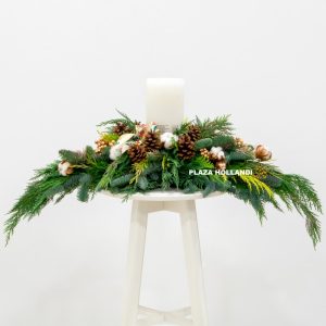 Christmas table arrangement with a large candle 