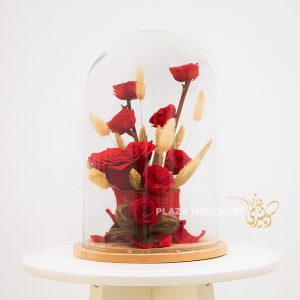 preserved red roses in a glass jar