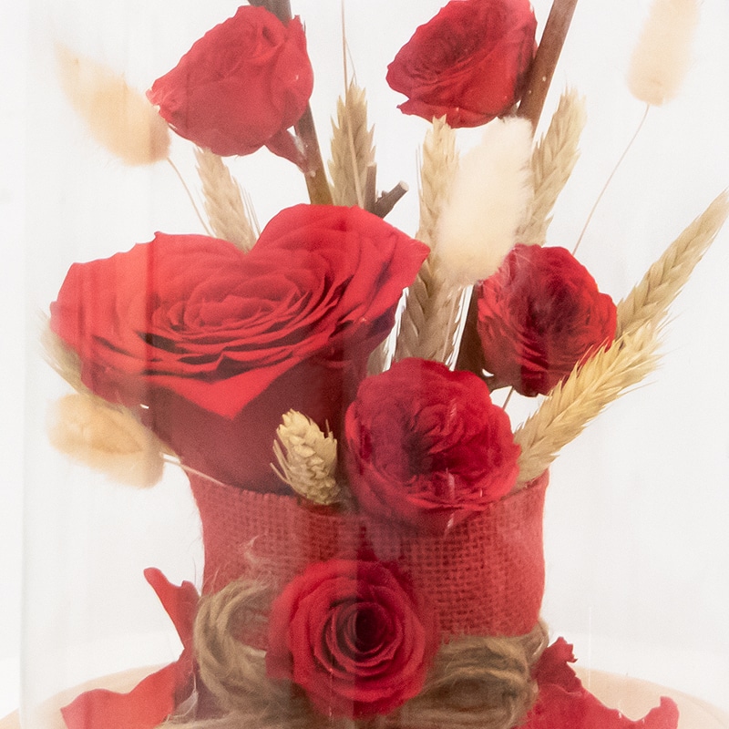 preserved red roses in a jar