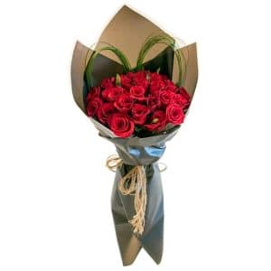 Red rose flower bouquet with black paper