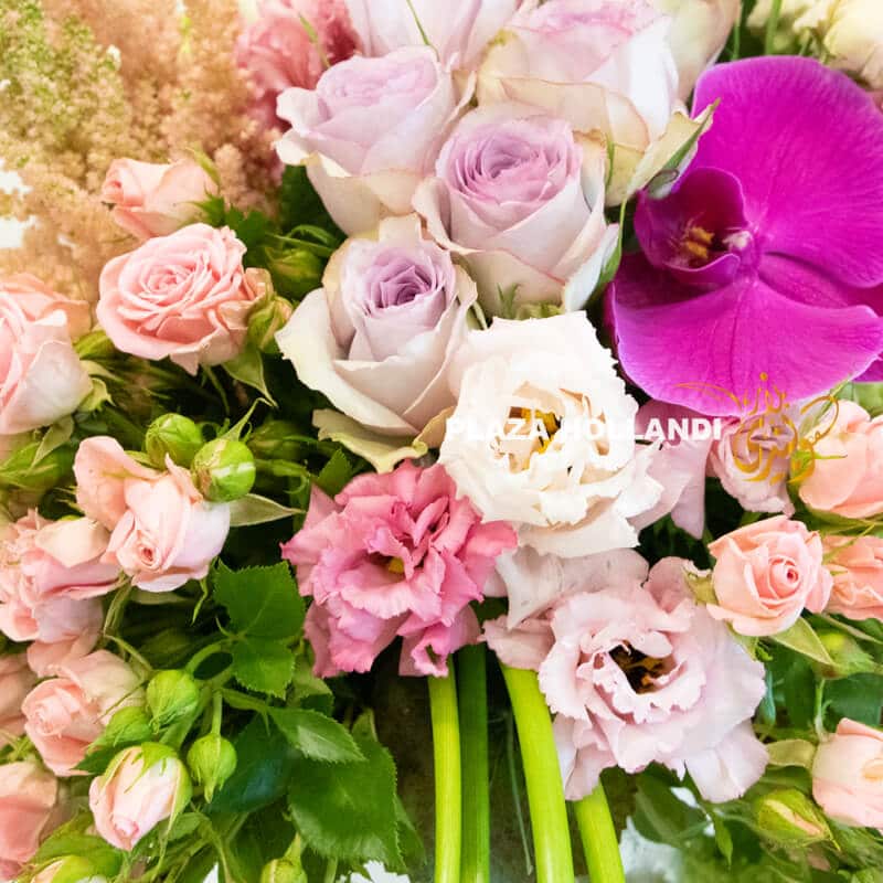A unique flower arrangement of pink and purple flowers