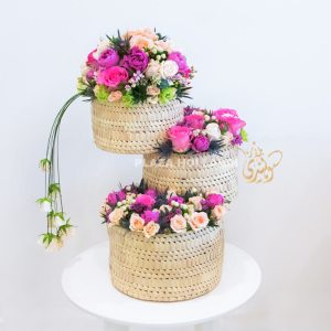 Three baskets with pink and white flowers