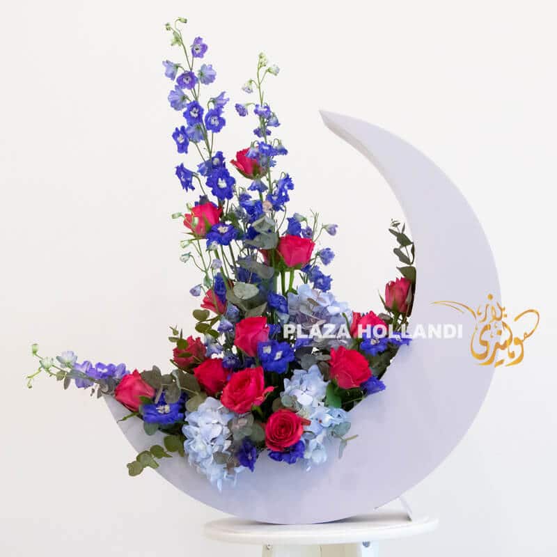 Blue crescent moon with roses for ramadan