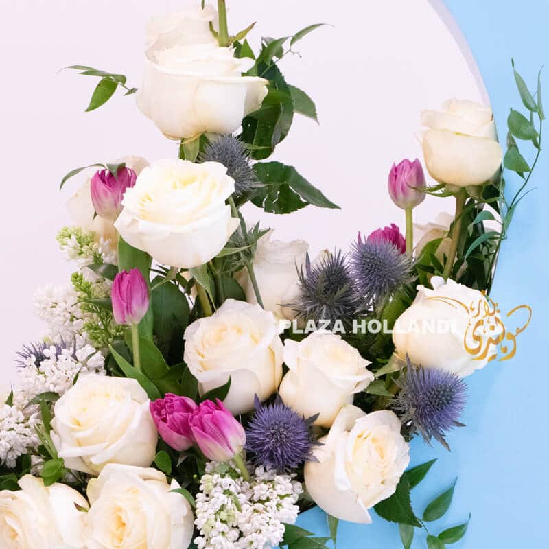 close up of tulips, white roses and Ramadan decoration