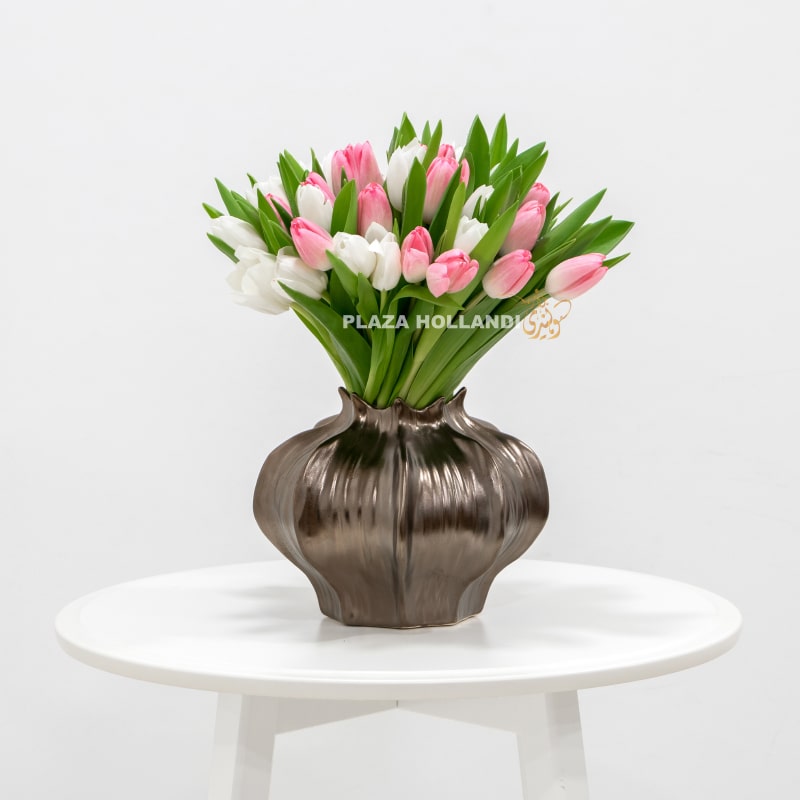 pink and white tulips in a vase