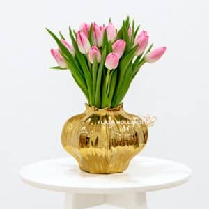 pink tulips in a gold vase