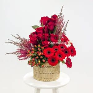 Red flower arrangement in a basket