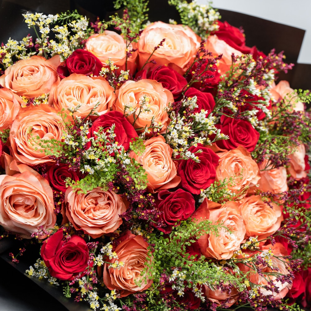 A28.1 Elegant Blend: Orange & Red Roses with White and Purple Limonium