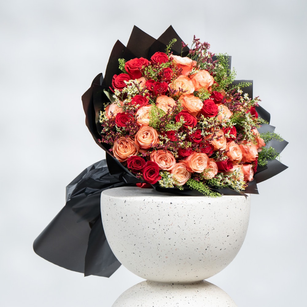 A28 Elegant Blend: Orange & Red Roses with White and Purple Limonium